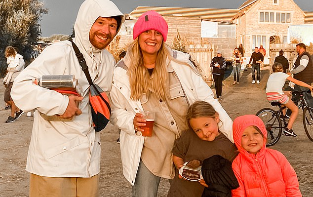 Cat enjoys a day out with Jimmy and the children ¿ with a drink in hand