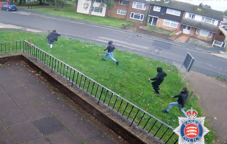 Surveillance footage of three people running away from a stabbing.