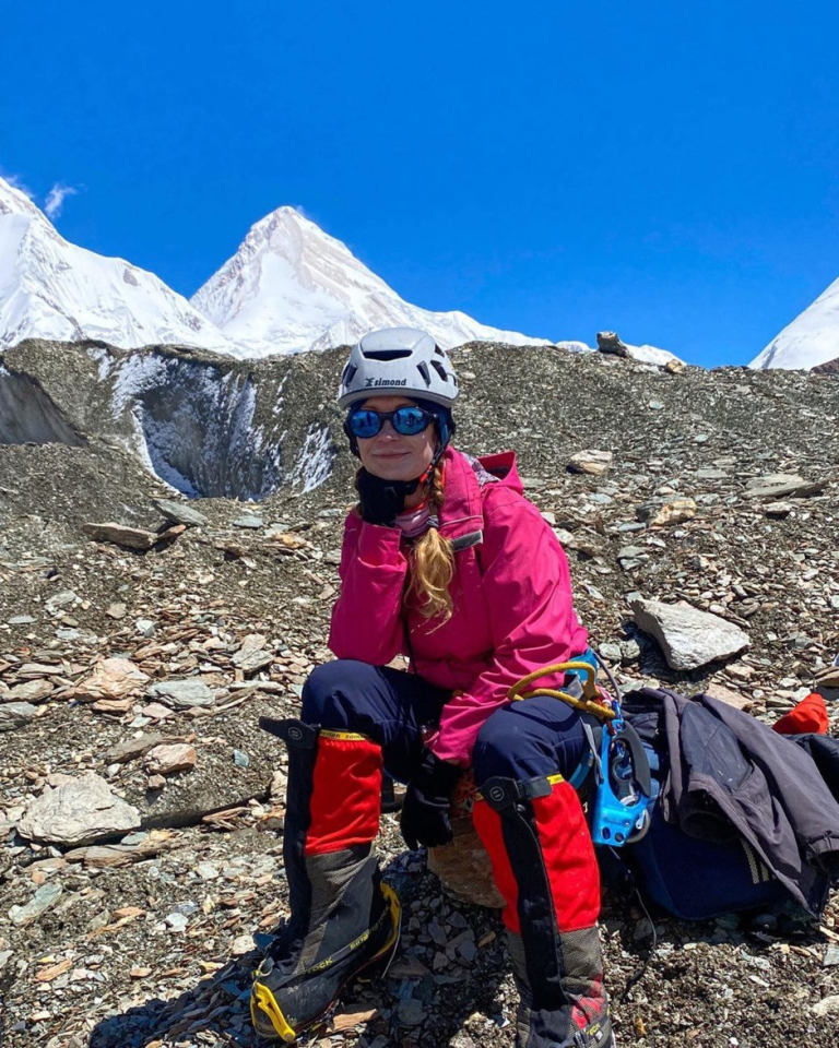 Woman resting during a mountain climb.
