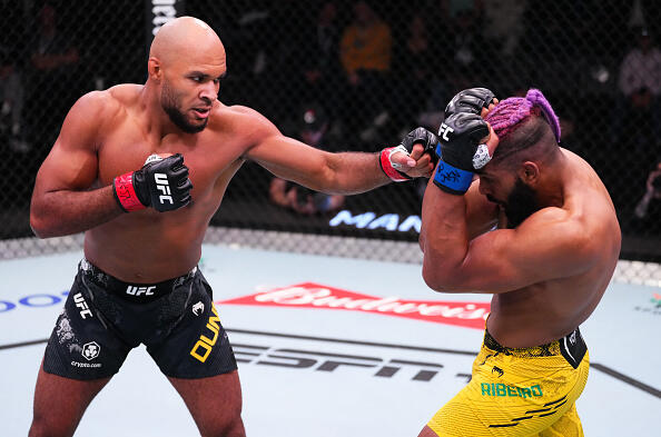 Christian Leroy Duncan punches Claudio Ribeiro in a UFC middleweight bout.