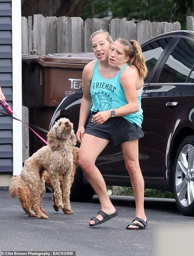 Conjoined twins Abby and Brittany Hensel were spotted out with their Labradoodl pups this week, taking it to a groomer