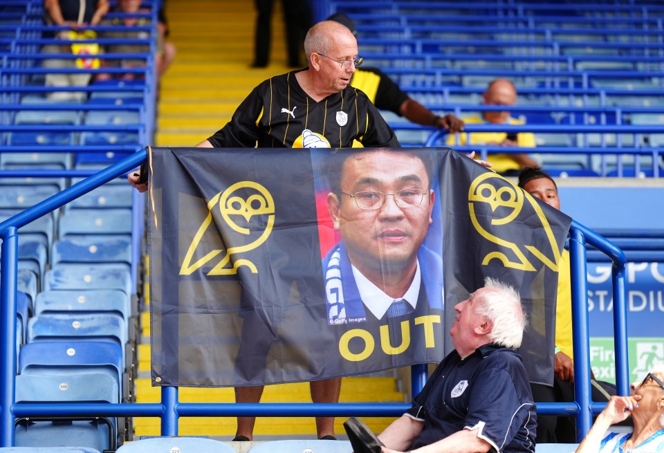 Sheffield Wednesday fans protest against club owner with banner.