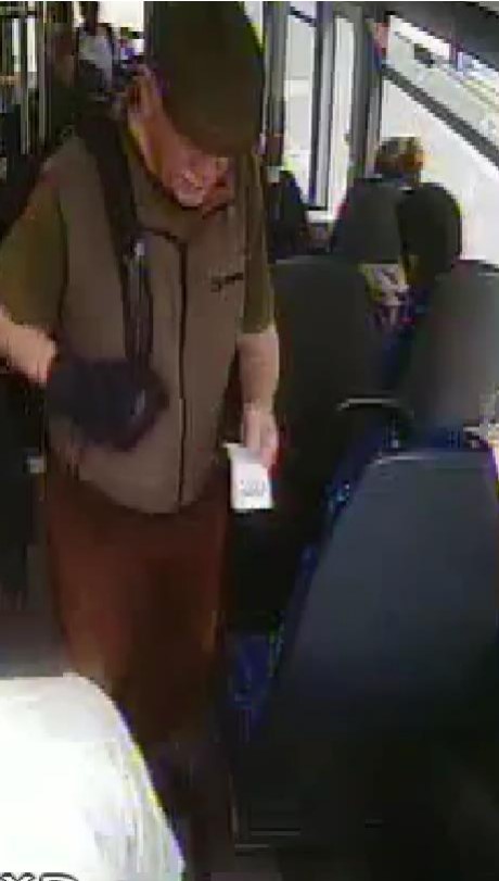 Surveillance image of a man on a bus.
