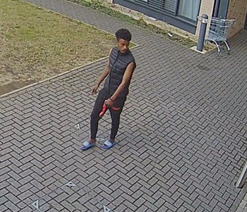 Surveillance image of a man police wish to speak to regarding an attempted murder.