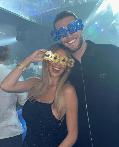 a man and a woman wearing glasses that say 2022