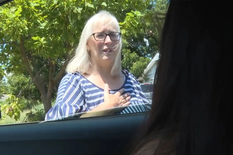 Grandmother Michelle speaking to someone in a car.