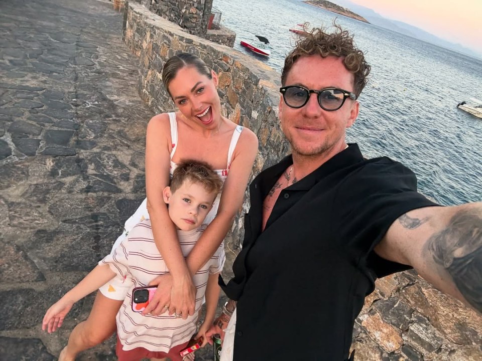 Selfie of a family of three on vacation.