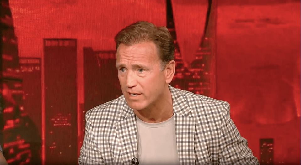 Screenshot of a man speaking.
