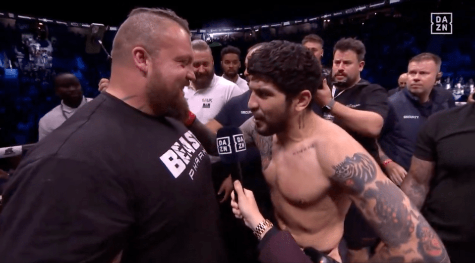 Two fighters facing each other after a match.