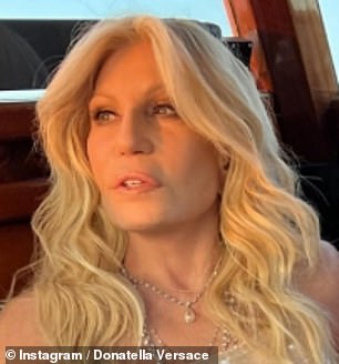Showing off her svelte physique, Donatella posed up a storm in the white sequinned gown with her fresh-faced complexion in full display