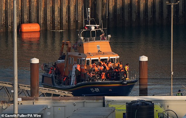 A group of people thought to be migrants are brought in to the Border Force compound in Dover, Kent, onboard an RNLI Lifeboat following a small boat incident in the Channel, August 11, 2025