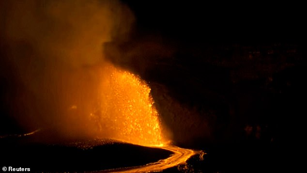 Hawaii's Kilauea volcano erupted in a spectacular display on Friday, as a few lucky onlookers watched molten lava shoot 100 feet into the air