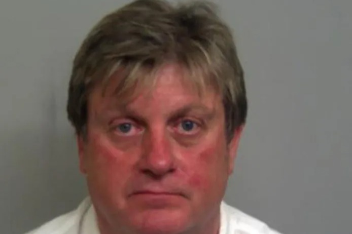 Mugshot of John Benson.