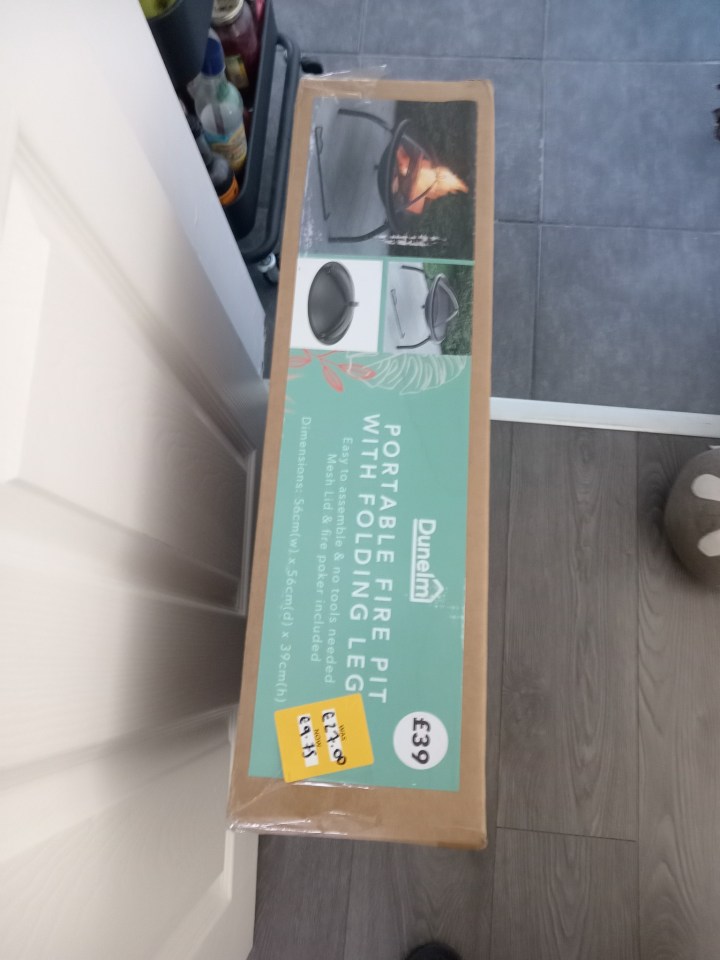 Dunelm portable folding fire pit in box.