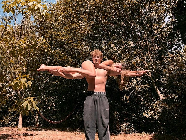 Esme Bertelsen being lifted by her boyfriend Luke Moreton