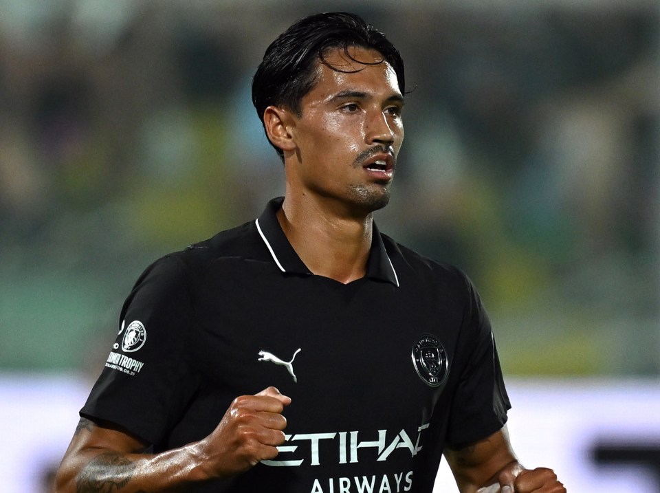 Tijjani Reijnders of Manchester City celebrating a goal.