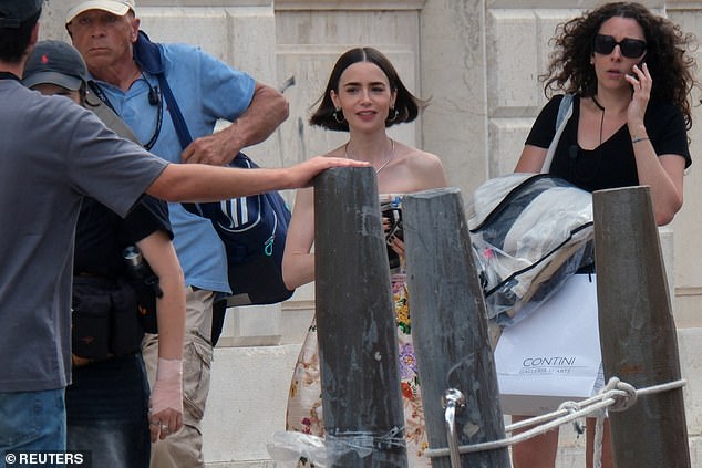 On Saturday the show's star Lily Collins was spotted out and about in Venice as filming appeared to resume following the sudden death of an assistant director