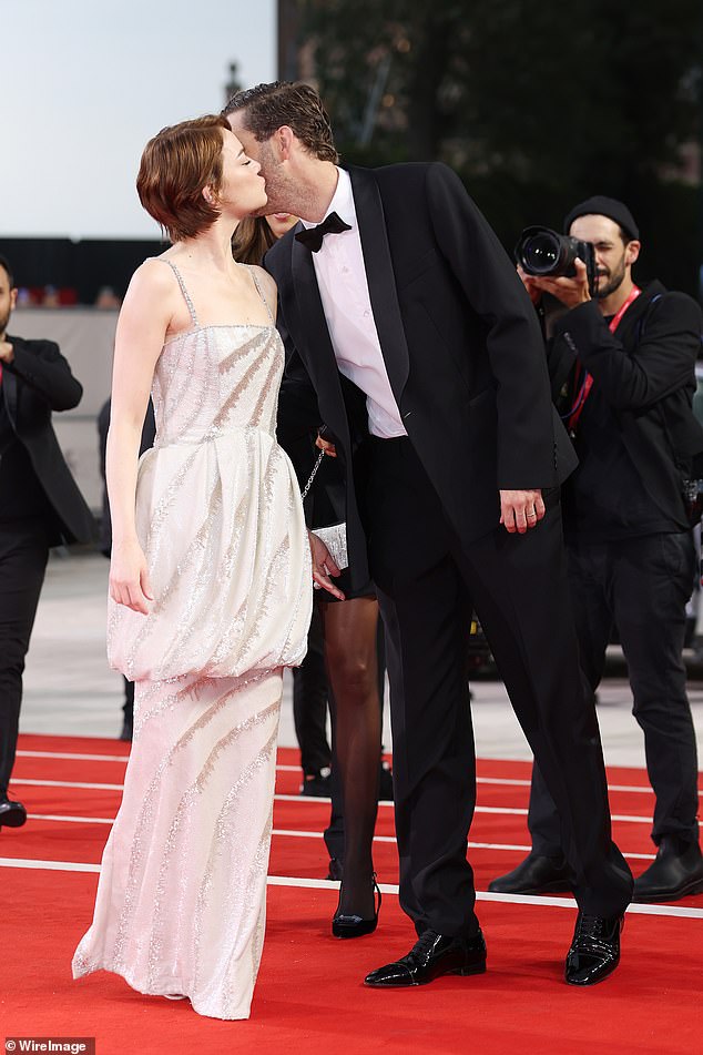 Emma Stone got a red carpet kiss from her husband Dave McClary as she was joined by Alicia Silverstone at the Bugonia premiere