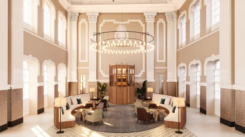 Illustration of a hotel lobby with circular seating and a large chandelier.