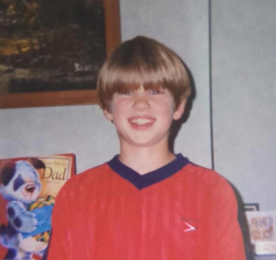Young Amanda Clapham in a red shirt.
