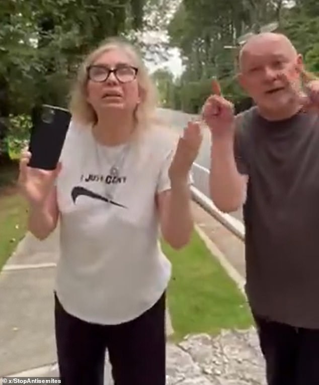 Anna and Mark Bouzyk (pictured) were caught on camera last month shouting abuse at David Lubin. Anna allegedly called David a 'k**e', 'corrupt Israeli' and said his 'daughter deserved to die'