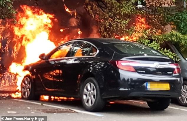 Footage shows a black Vauxhall Insignia being engulfed by an engine blaze in Bournebrook, Birmingham, at 5:45pm on Monday