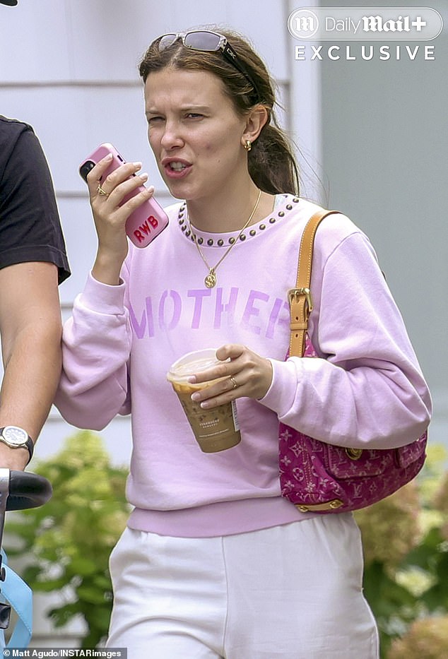 Millie Bobby Brown was spotted out with her husband and their new daughter, and fans think the initials RWB on her phone case might be a clue to her baby's name