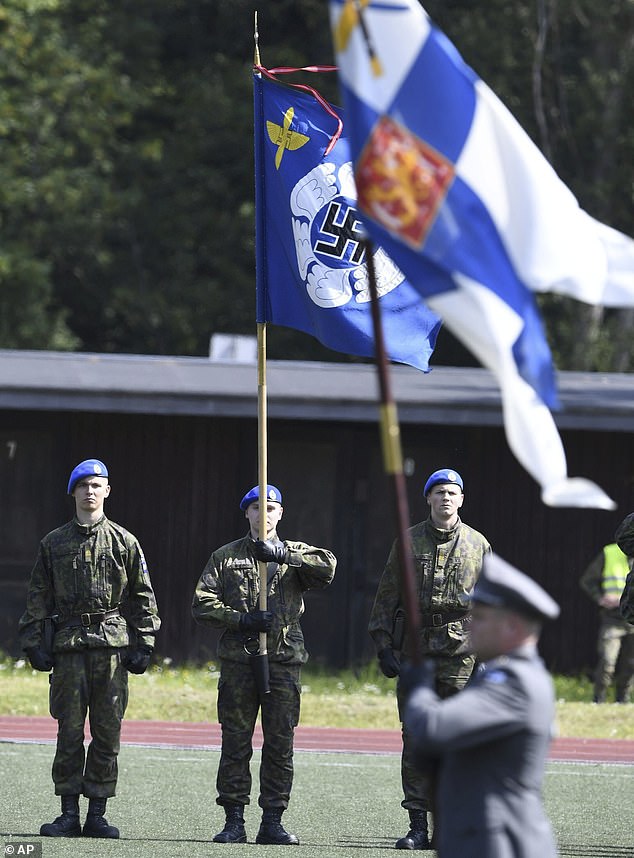 The Nordic country is set to remove the symbol from the standard (pictured in 2019) because its presence has created 'awkward situations with foreign visitors'