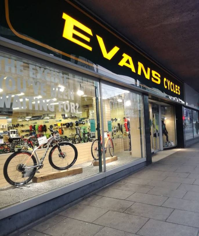 Evans Cycles storefront with bicycles in the window.
