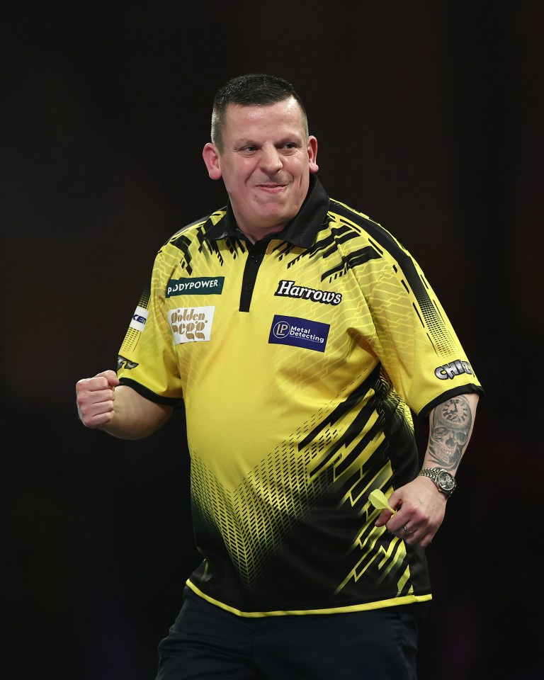 Dave Chisnall of England celebrating during a darts match.