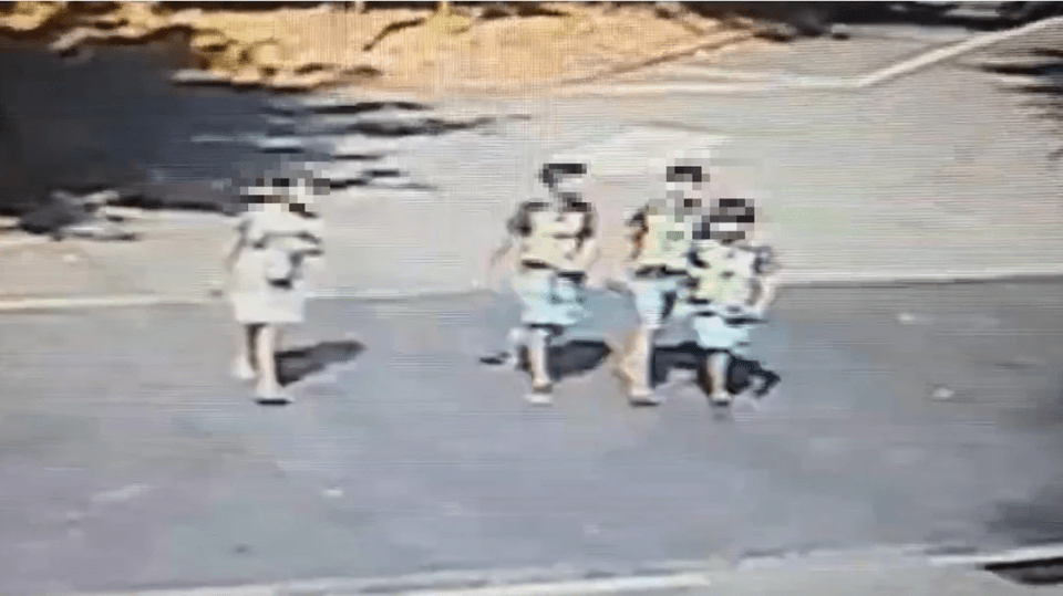 Security camera footage of four children and a woman.