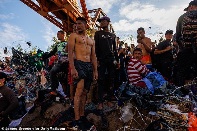 According to national security experts, people could taken advantage of the Biden Administration's lawless southern border and crossed illegally into the US alongside approximately 10 million illegal immigrants from 2020 to 2024 (Pictured: Venezuelan migrants on Texas border in September 2023)
