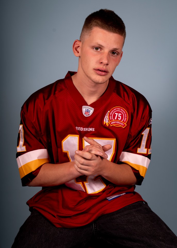Portrait of a young man wearing a Washington Redskins jersey.