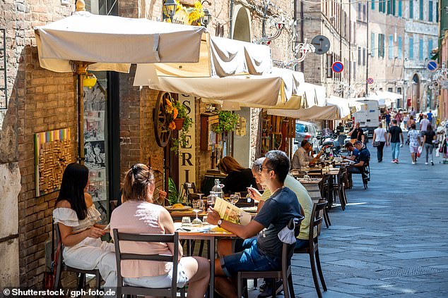 Fiepet Confesercenti, the leading trade association for Italian restauranteurs, is demanding an official correction, claiming the post misleads readers and disrespects Italian tradition. Pictured: Diners enjoy a meal in the sun in Florence, Italy