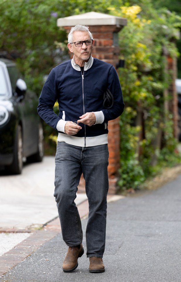 Gary Lineker walking down a street.