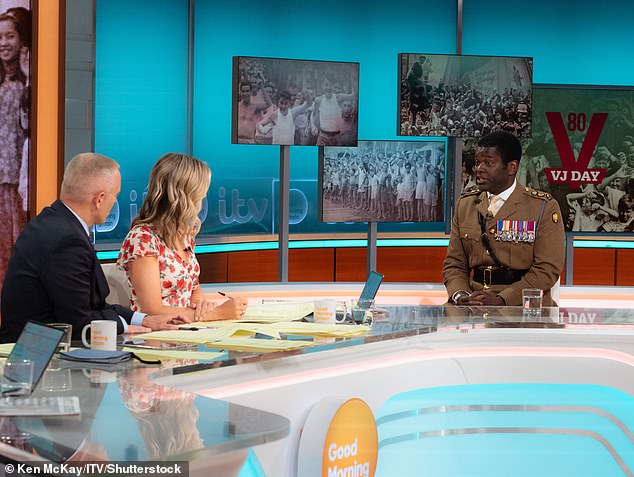 Rob Rinder and Charlotte Hawkins intervieiwng Lieutenant Colonel Nana Twumasi-Ankrah on Friday's episode of GMB
