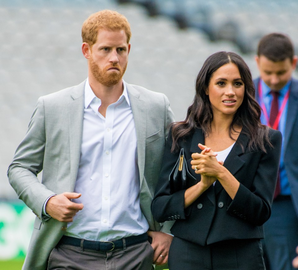Prince Harry and Meghan Markle walking together.
