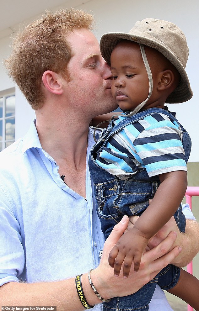 Prince Harry is planning to outflank the boardroom rival who accused him of bullying by launching a new African children's charity, The Mail on Sunday can reveal. Pictured: Harry on a visit to Lesotho with Sentebale in 2014