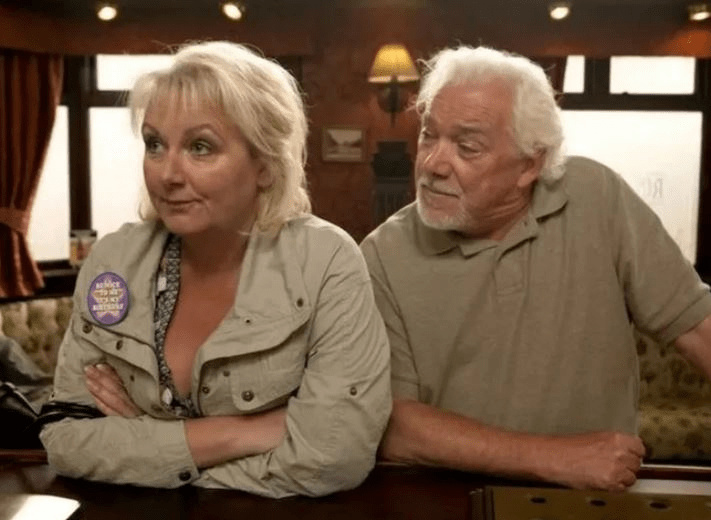 A woman and a man at a bar.