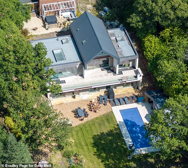 Lisa and Tim Klaver claim they will have to knock down their sprawling dream home (pictured) near Farnham, Surrey, after North Down Construction built it so poorly
