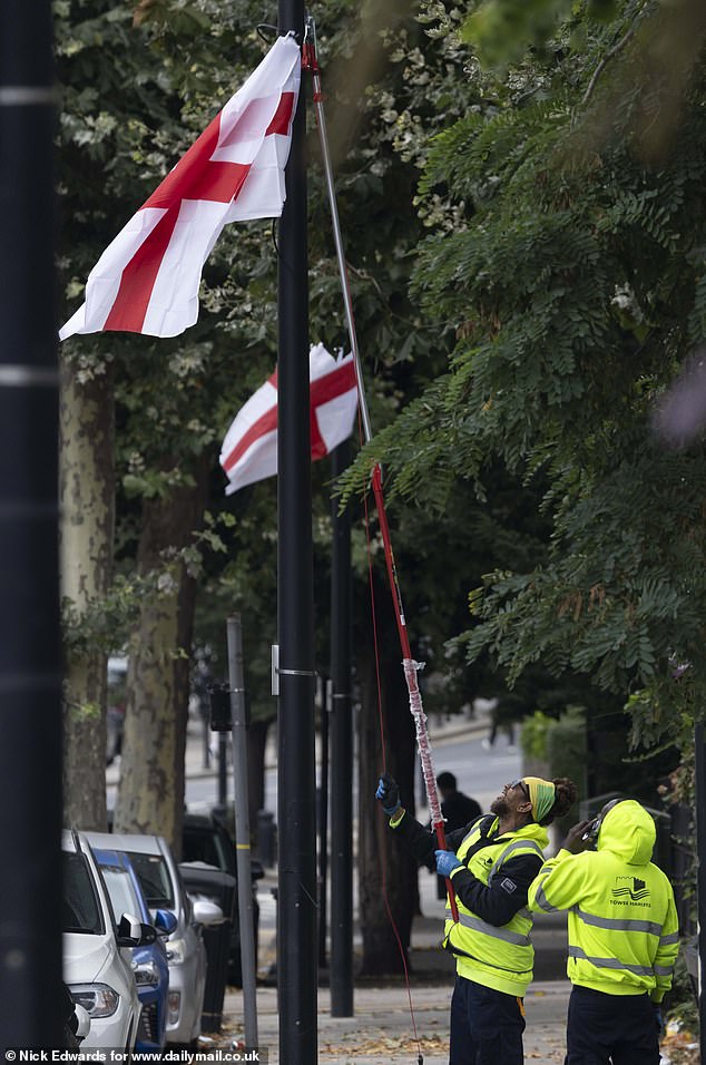 Yesterday, as our pictures show, came the extraordinary spectacle of council workers using extendable shears to remove St George¿s Cross flags from lamp posts in the east London borough of Tower Hamlets