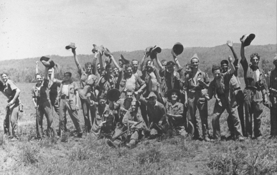 British soldiers in Burma during World War II waving to a rescue plane.