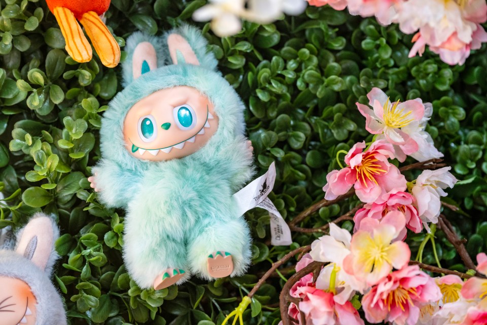 Labubu plush toy on display.