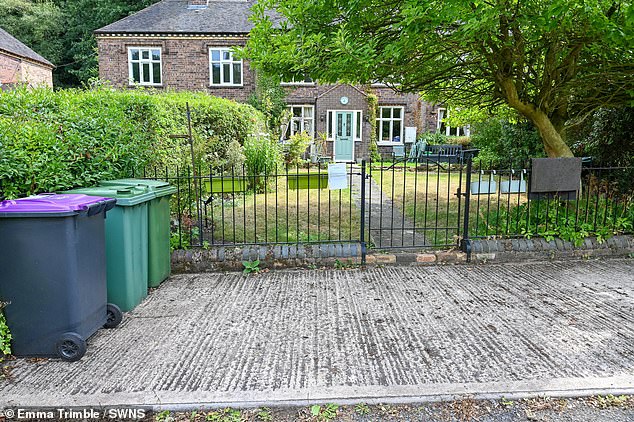 A husband has been refused permission to build a parking space for his disabled wife outside their village home - over fears it would 'harm the character' of the heritage site where they live