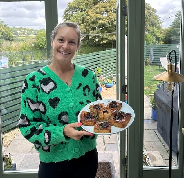 Ellen Manning poses with Mehgan's caramelized onion tarts as she reviews the Duchess' recipes