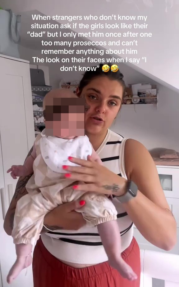 Woman holding baby, unsure if baby resembles father.