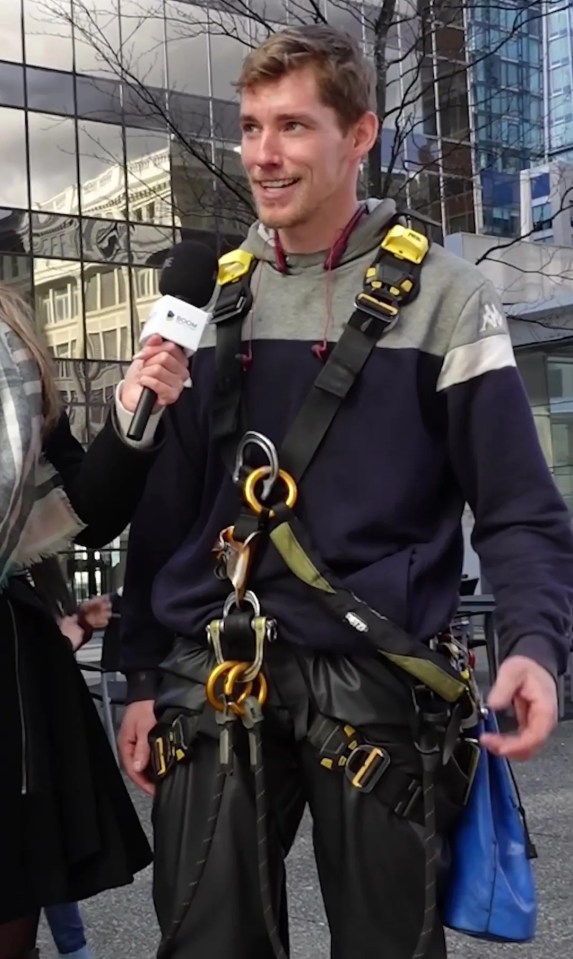 a man is being interviewed by a woman wearing a kappa sweatshirt