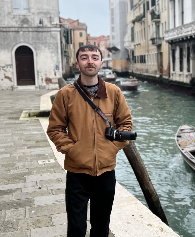 Man with camera in Venice.