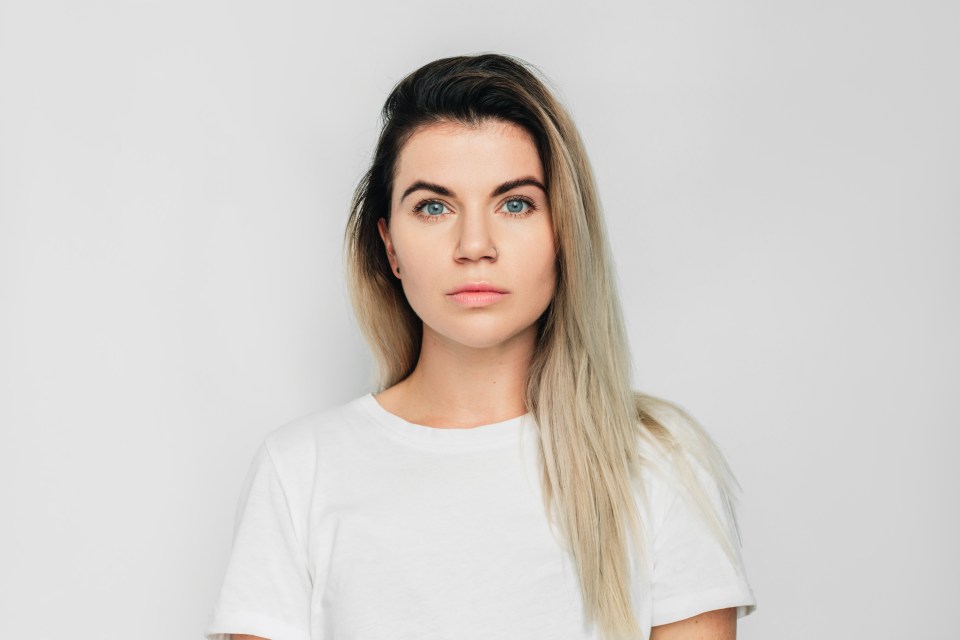 Portrait of a young woman with long blonde hair.
