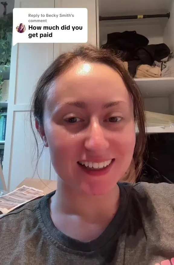 Woman responding to a comment asking how much she was paid for being an extra on Hollyoaks.